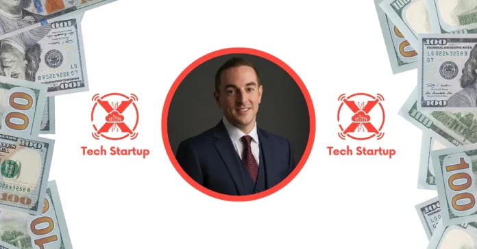 Robert Pera Net Worth Professional studio portrait of a Robert Pera in a navy blue suit and burgundy tie against a dark charcoal background